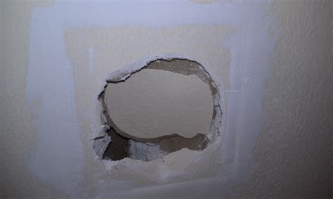 how to fix old electrical box hole in wall|hole in wall repair video.